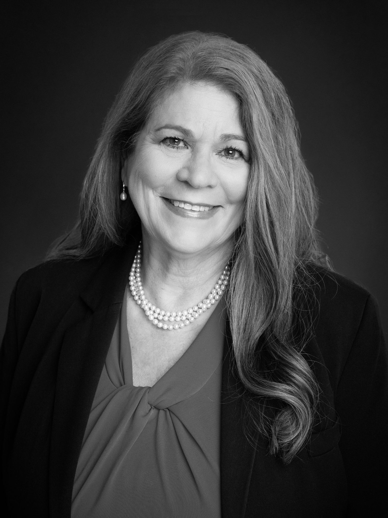 Black and white headshot of a woman taken by Jefferson County headshot photographer
