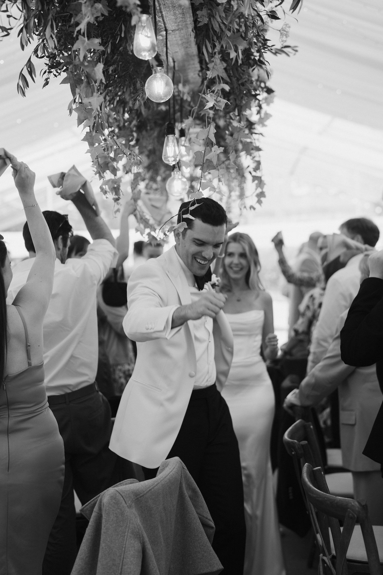 bride and groom getting cheered as they enter their wedding breakfast at hamswell house wedding in bath