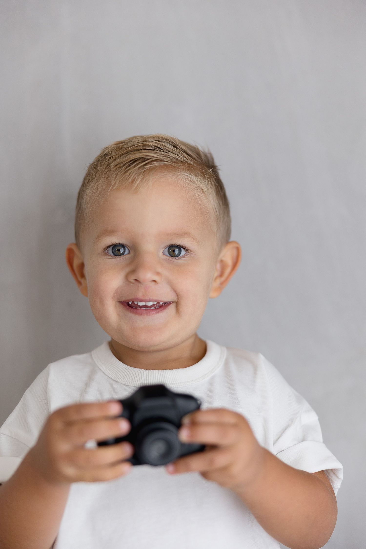 Studio family portraits of toddler in California with cozy, minimal backdrop