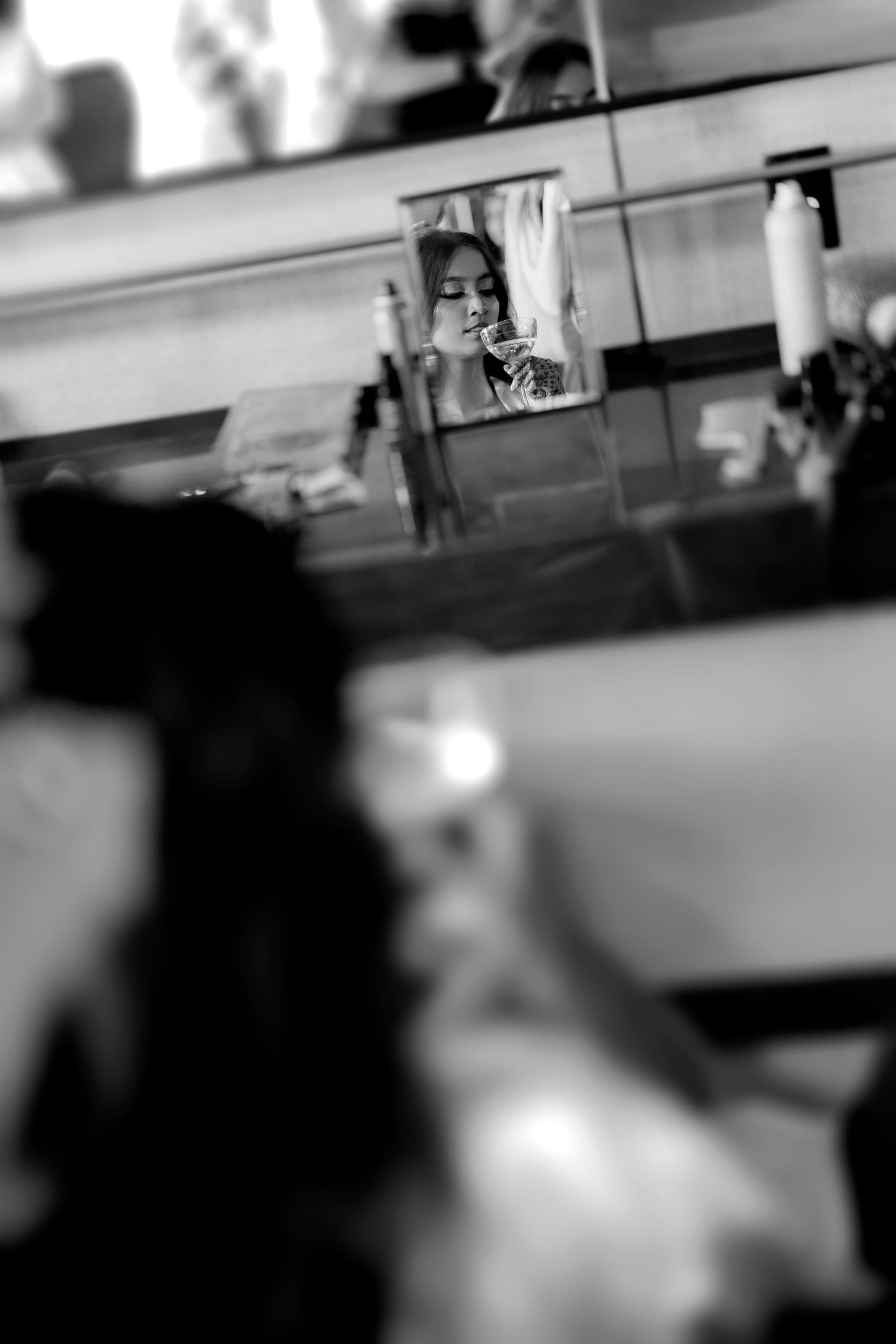 Blurred black and white artistic photograph of an indoor event space.