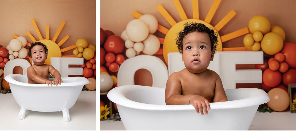 Baby sitting in white tub with colorful balloon backdrop during milestone session in Austin photography studio
