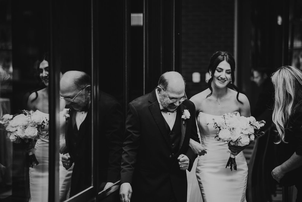 A black and white wedding photo montage shows candid moments of celebration and dancing at a reception.