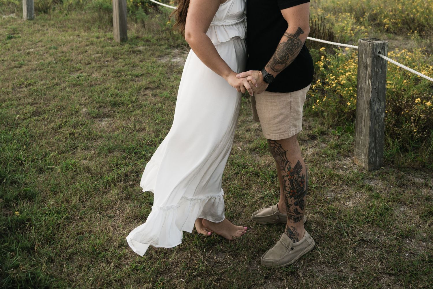 Couple in wedding attire walking together through a grassy outdoor setting in multiple candid shots.