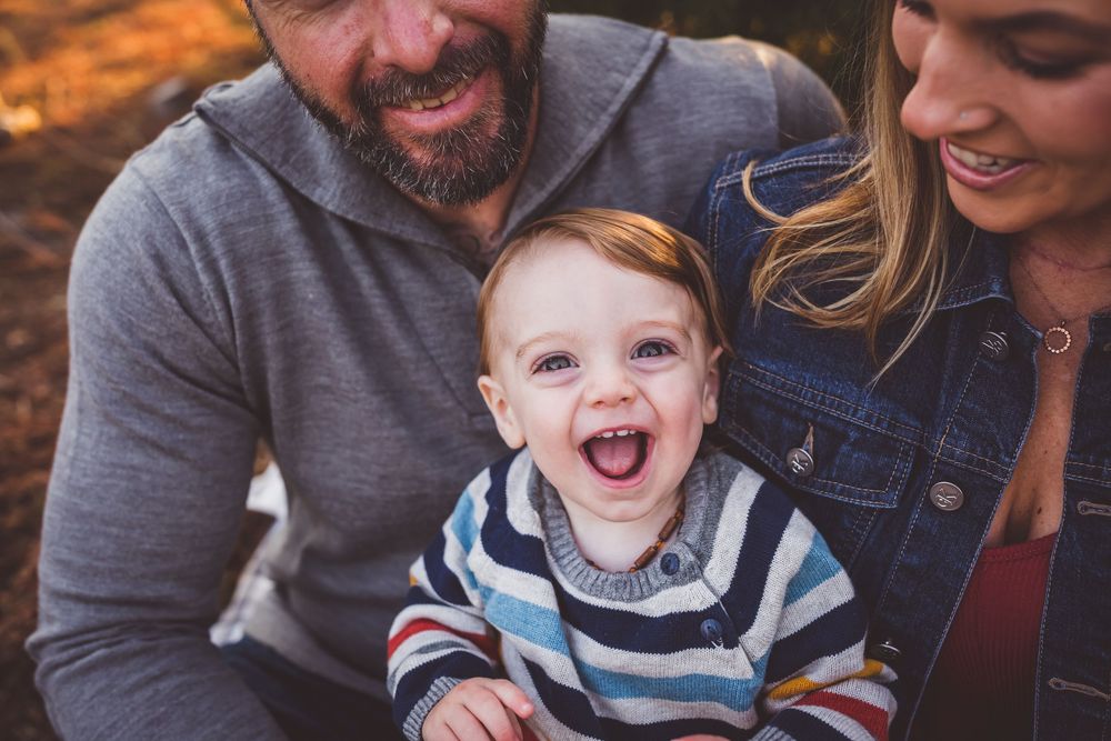A series of candid family photos showing joyful interactions and laughter in warm, natural lighting.