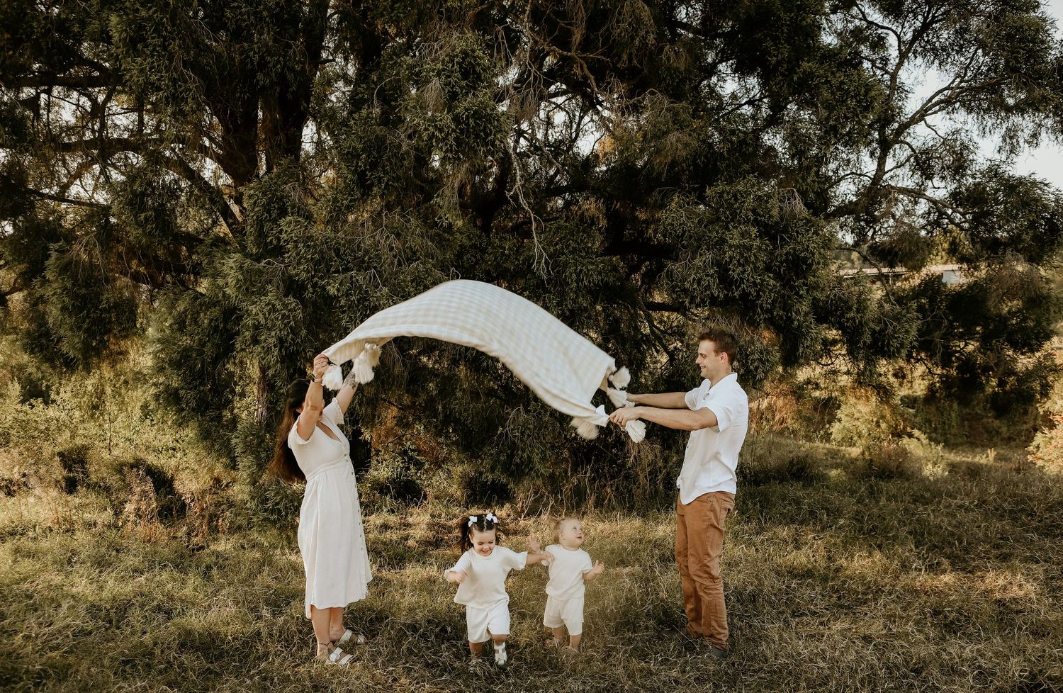 A series of candid outdoor photographs taken in a rustic wooded setting during golden hour lighting.