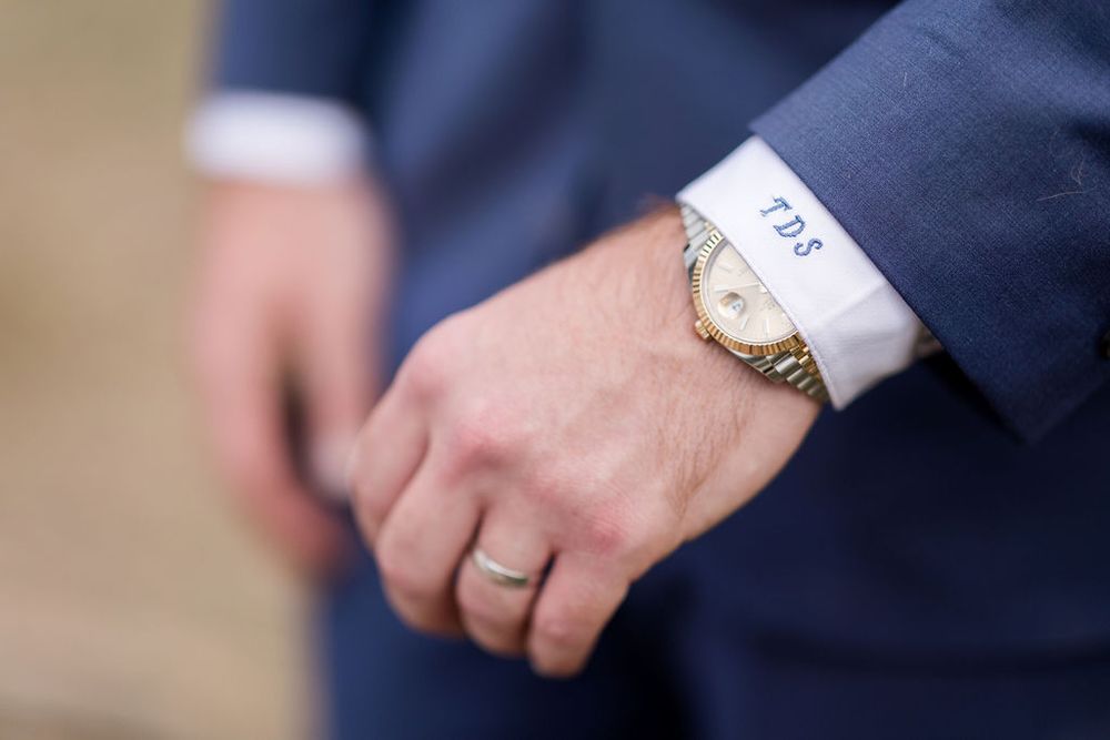 Close-up view of hands exchanging business cards during a professional meeting.