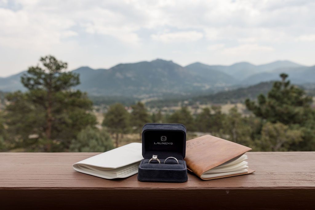 A scenic mountain landscape with trees and a wooden railing stretches across multiple connected panoramic views.