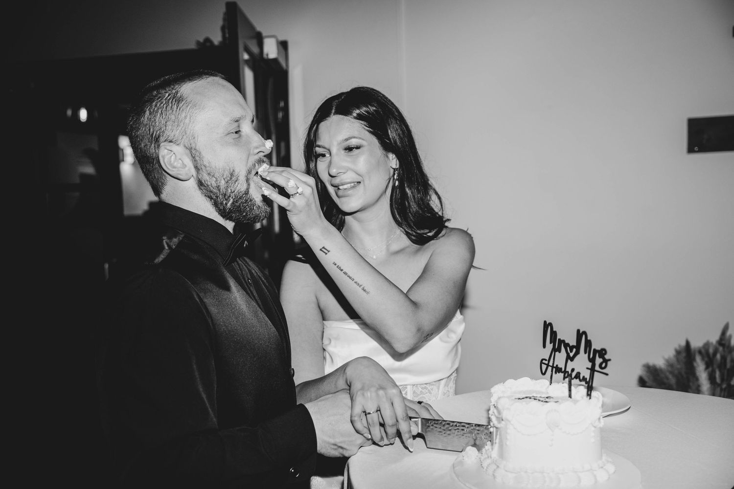 A black and white photo collage showing intimate wedding moments with couples dancing and embracing at a reception.