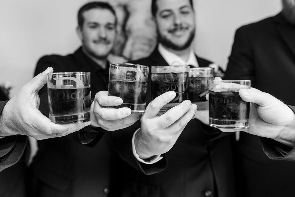 A sequence of wedding party members toasting with shot glasses in a celebratory moment.