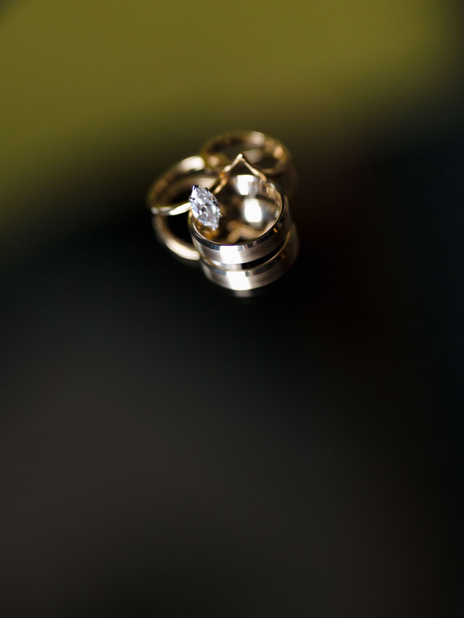 Artistic macro shots of wedding rings with shallow depth of field.