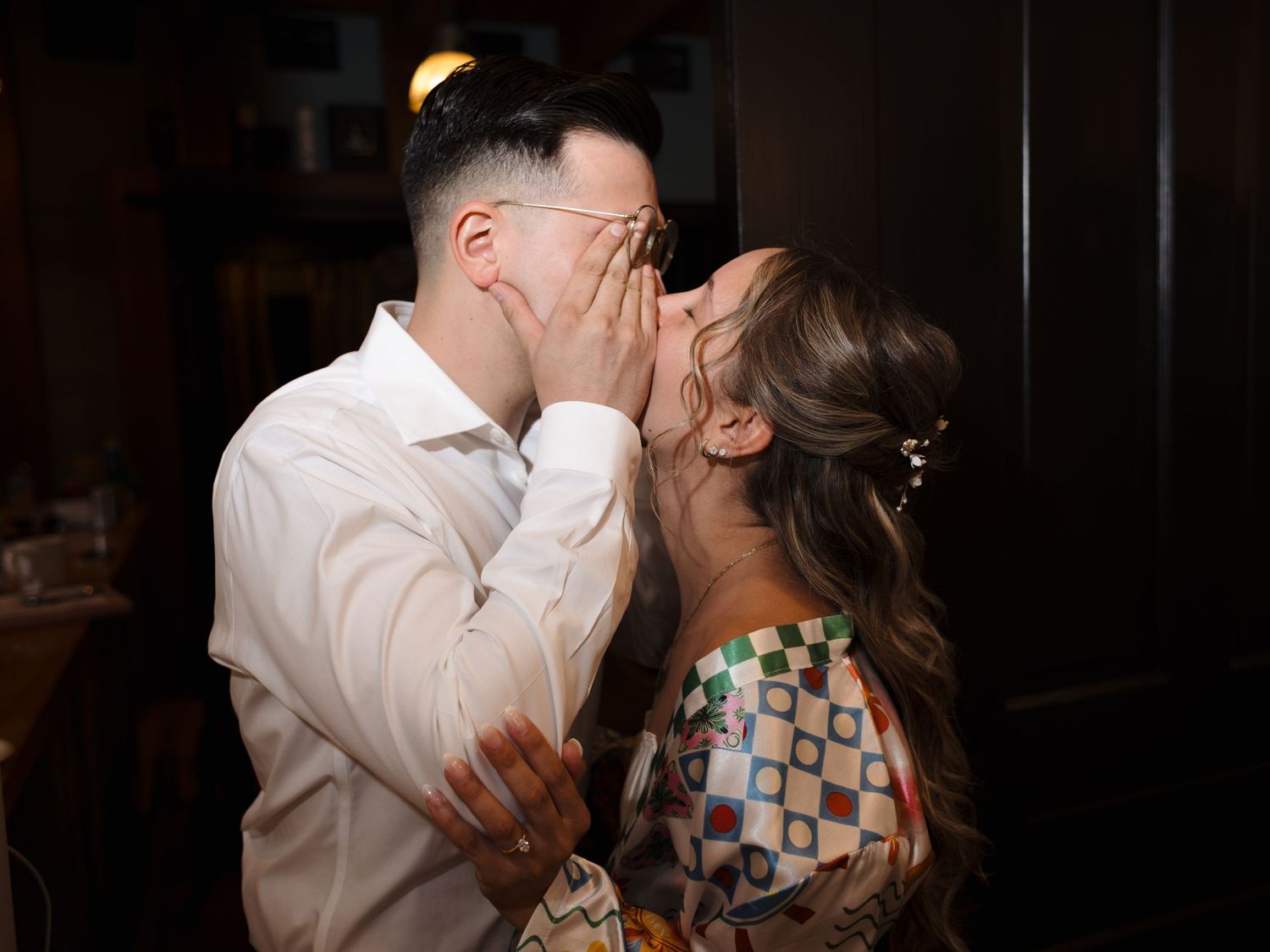 A tender moment shared between a couple during their wedding celebration.