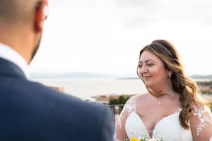 Emotional wedding ceremony moments captured against mountain backdrop during vow exchange.