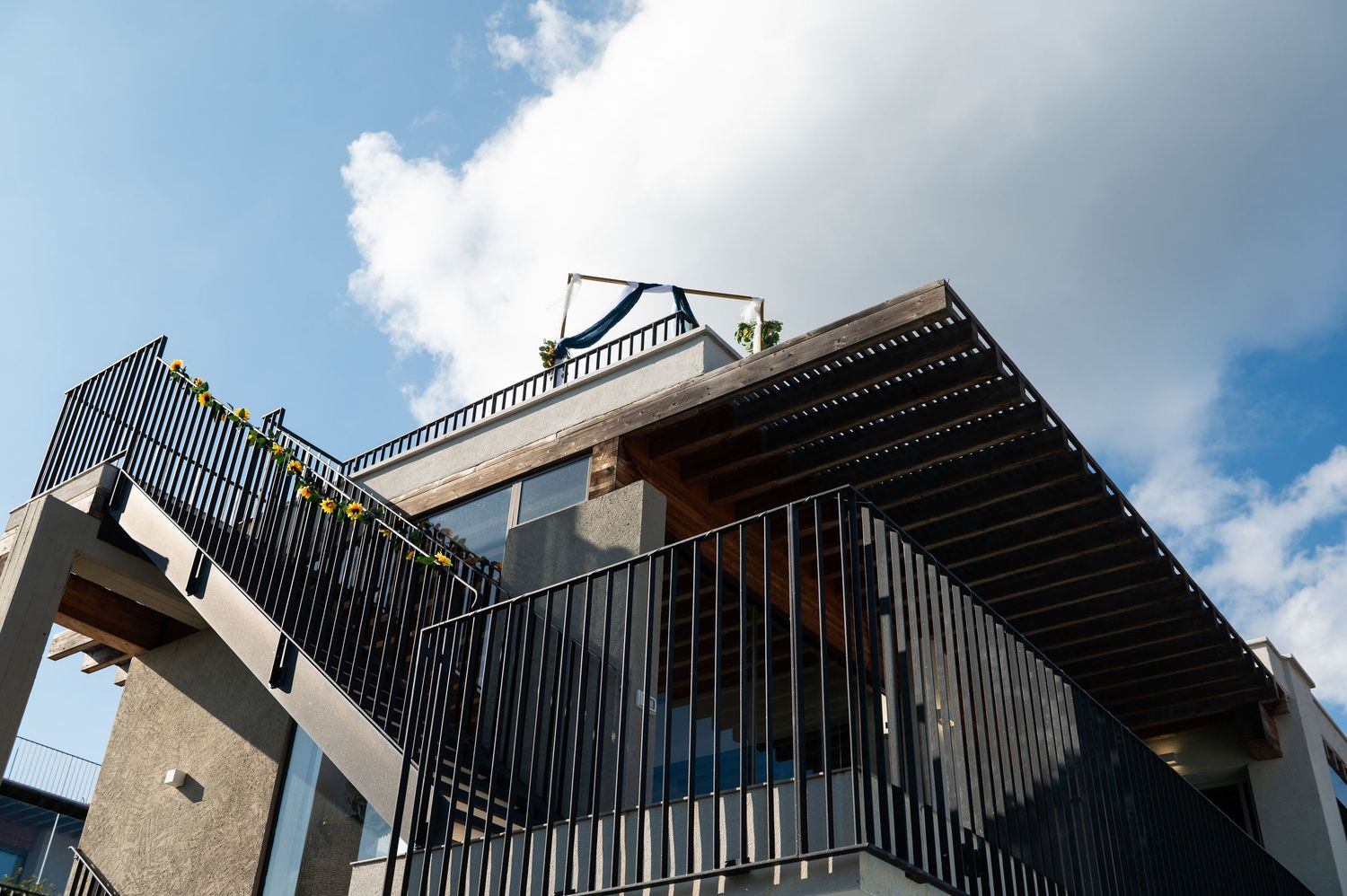 Modern architectural details with geometric lines against blue sky.