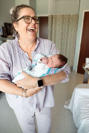 Memphis family photographer captures legacy moments with grandparents who want photos with their grandchildren and newborns.