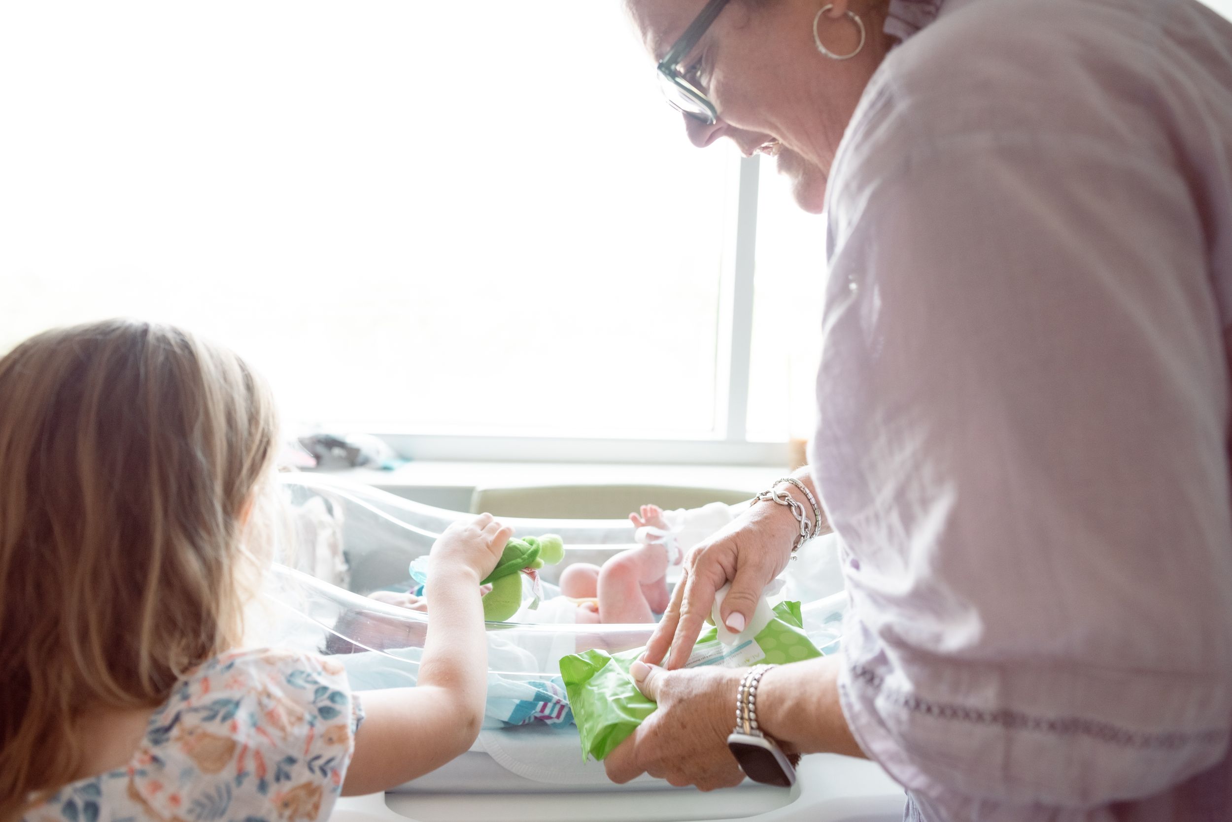 Memphis family photographer captures legacy moments with grandparents who want photos with their grandchildren and newborns.