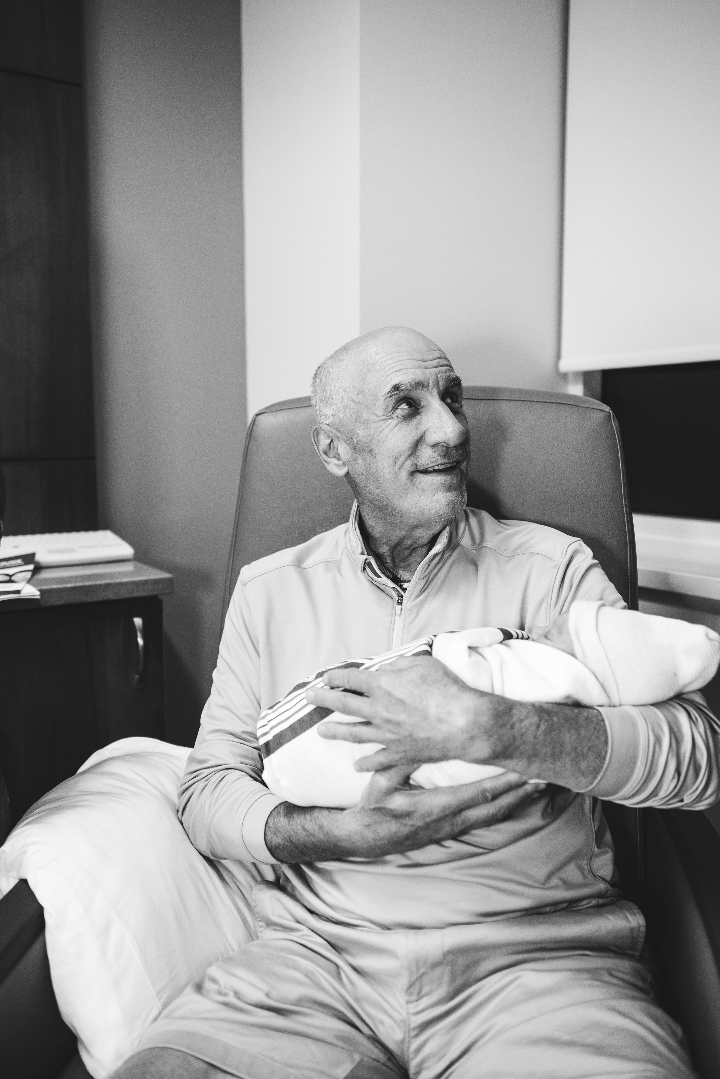 Memphis family photographer Lauren Wallis Photography captures grandfather and grandson right after sweet hospital birth.