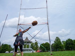 Weight throwing practice sequence showing technique progression on grass field.
