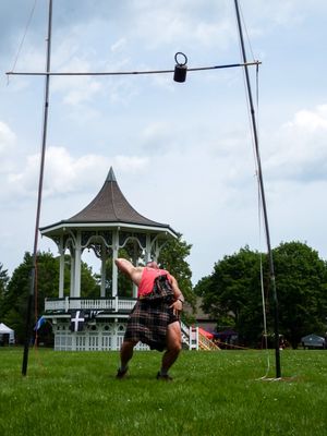 Sequential shots of weight throw practice at Highland Games training session.