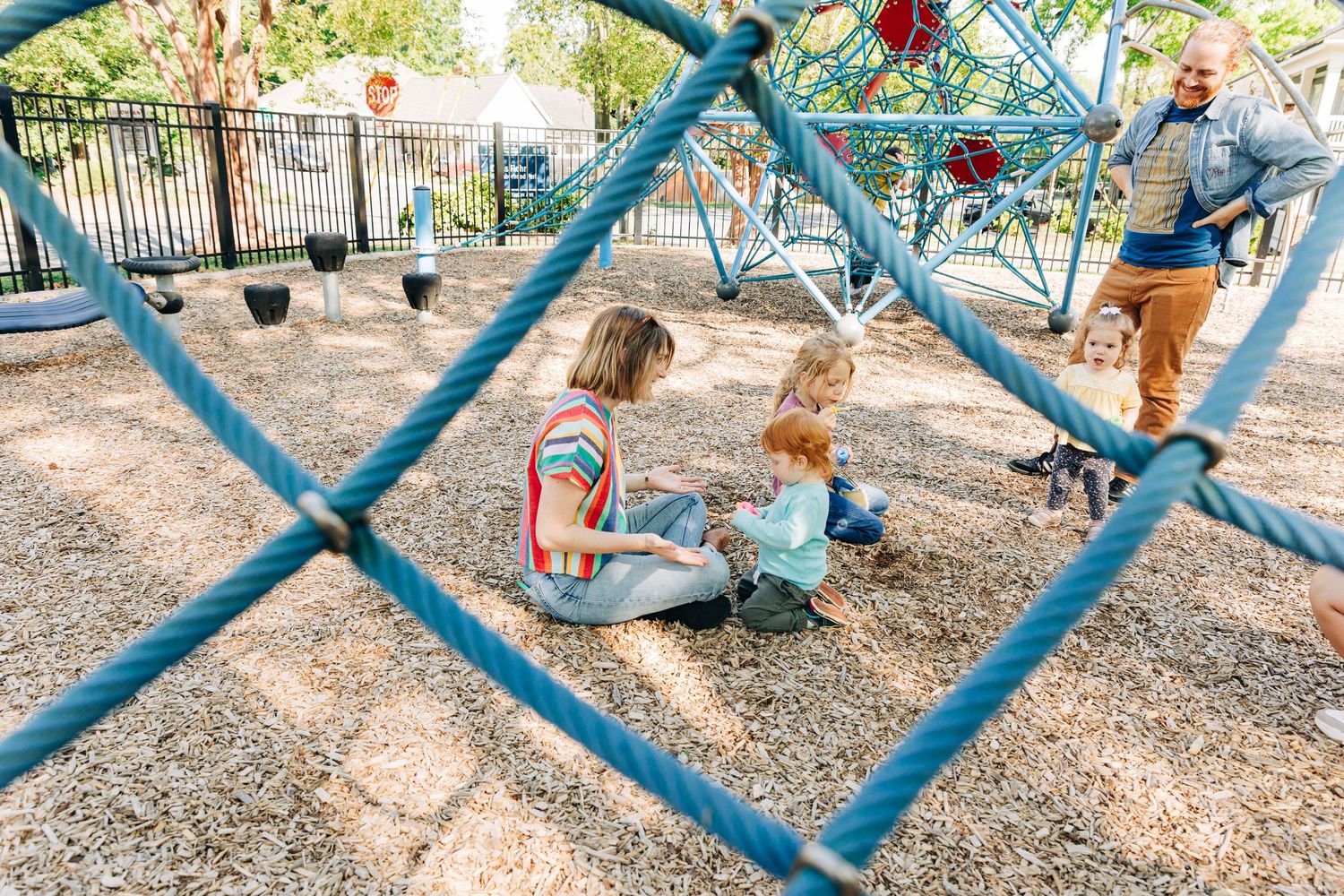 Family playing at Charlotte park.
