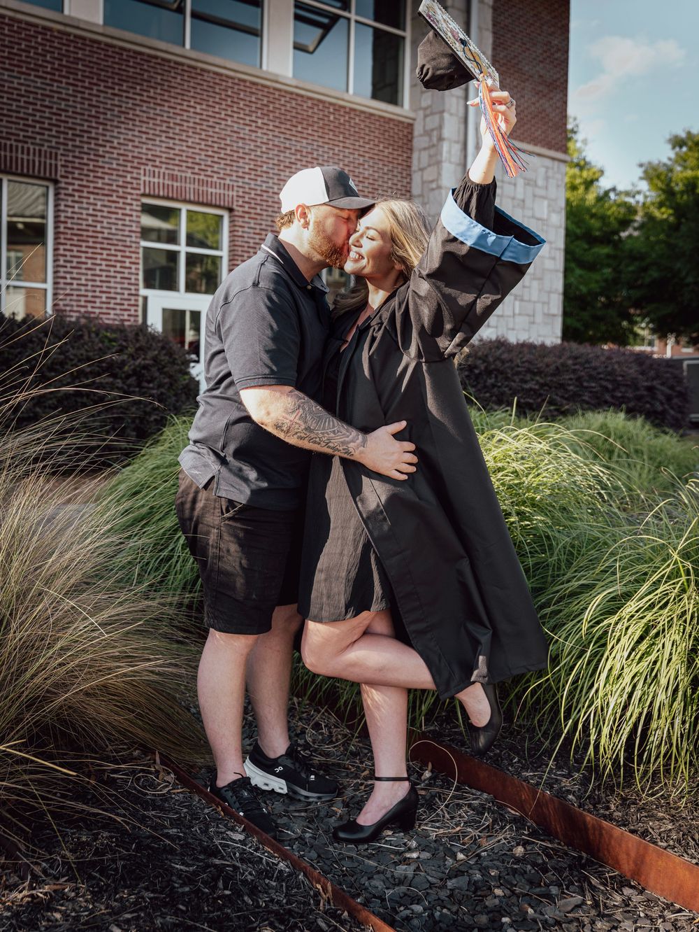 Cartersville Georgia Highlands College Campus. RN Graduate Portrait Session. Alumni. Nursing School Graduate with Supportive Spouse