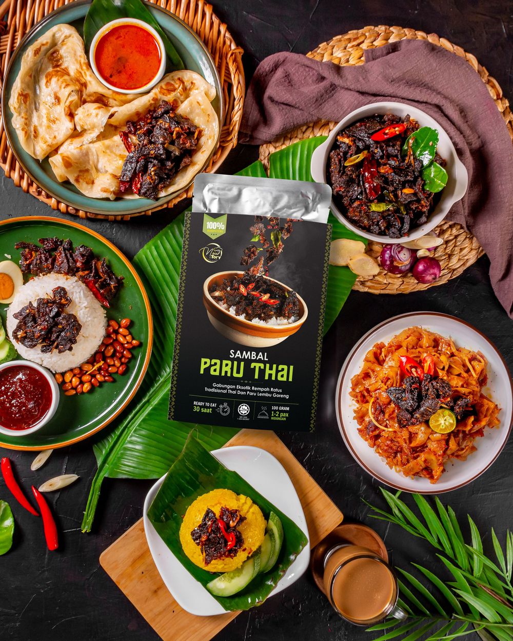 Traditional Asian dishes served on banana leaves with various spicy sauces and accompaniments.