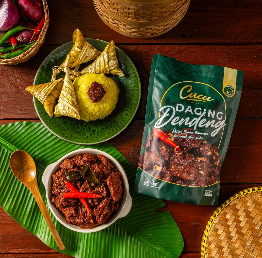 Traditional Indonesian dishes served on banana leaves with packaged condiments.