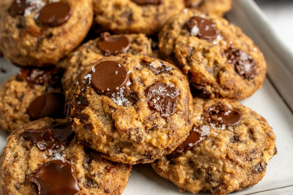 Close up of gooey chocolate chip cookies with melted chocolate chunks.