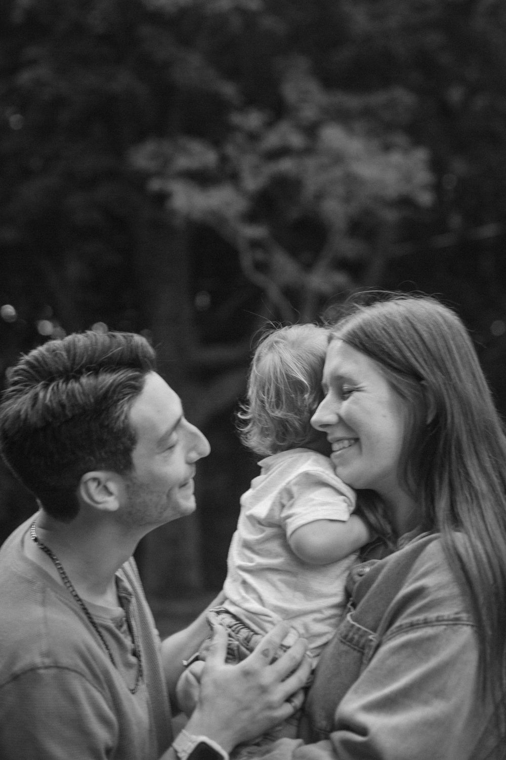 Family of three during their family session, in black and white.