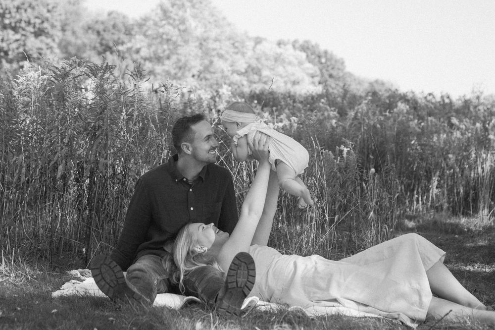 A family of three during their Grand Rapids family session in black and white.