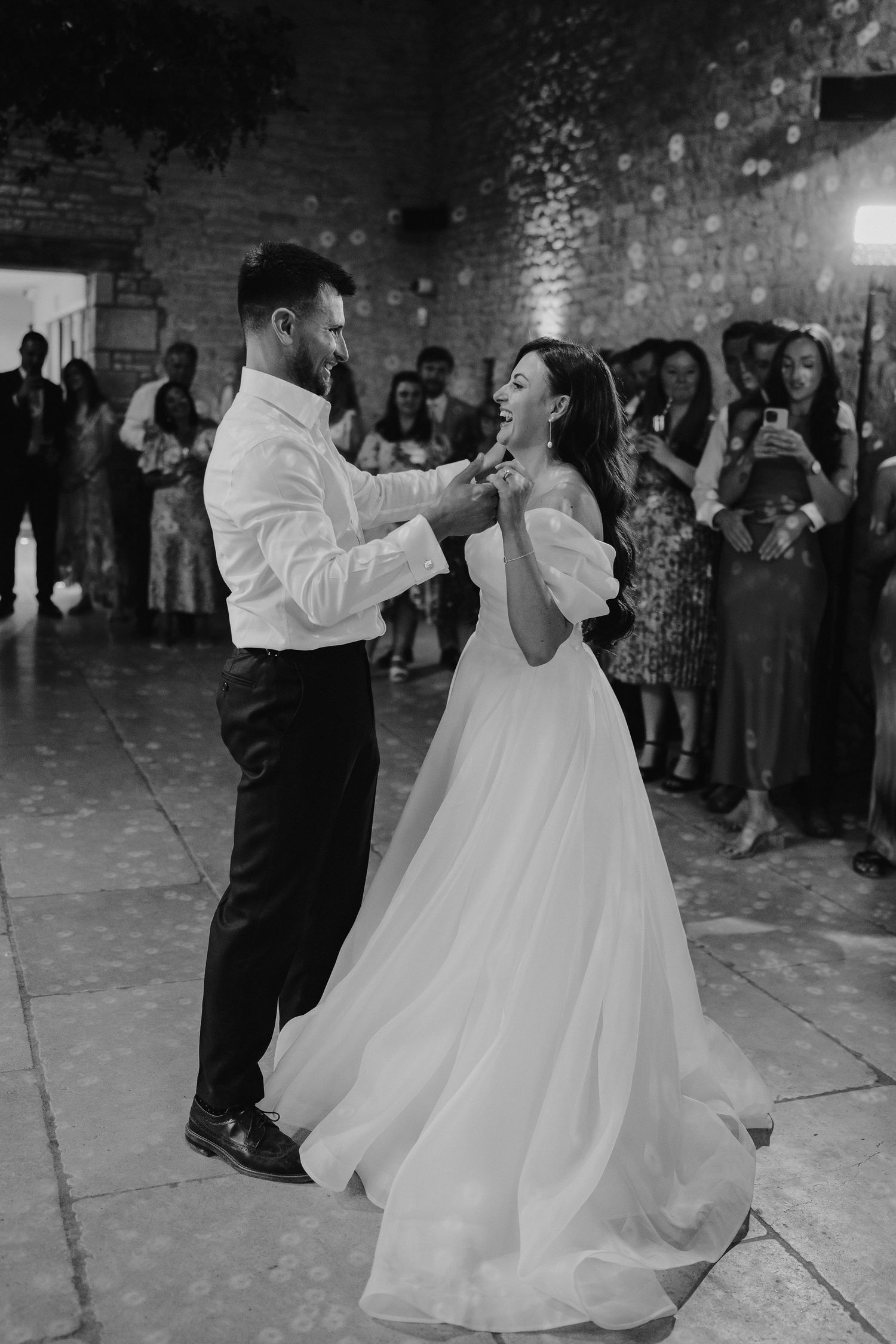 bride and groom dancing at yardspace old gore in cirencester
