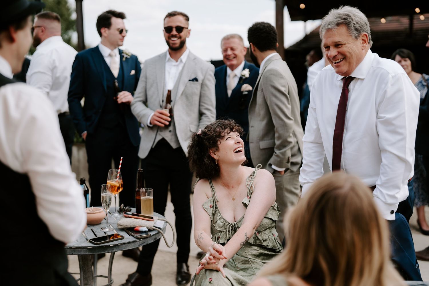 wedding guests enjoying drinks reception at wedding at yardspace old gore in cirencester