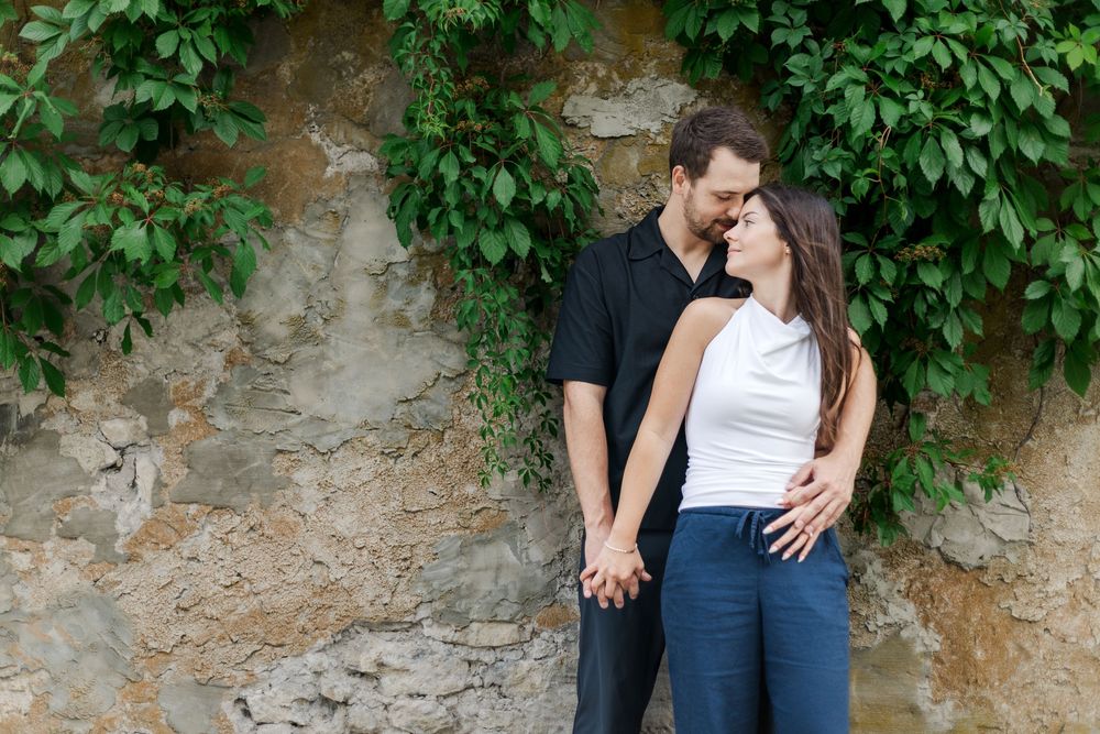 Couple snuggled together during their downtown elora engagement session.