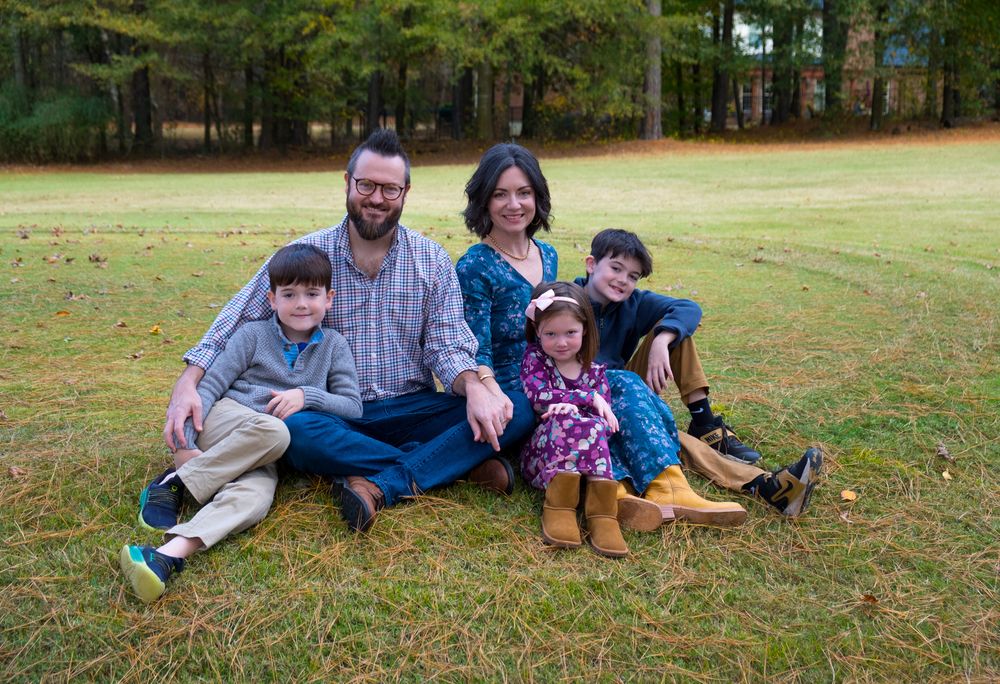 Family photography, children running around the gingko tree and mom and dad. Casual relaxed family photoshoot. Action family shot. Family