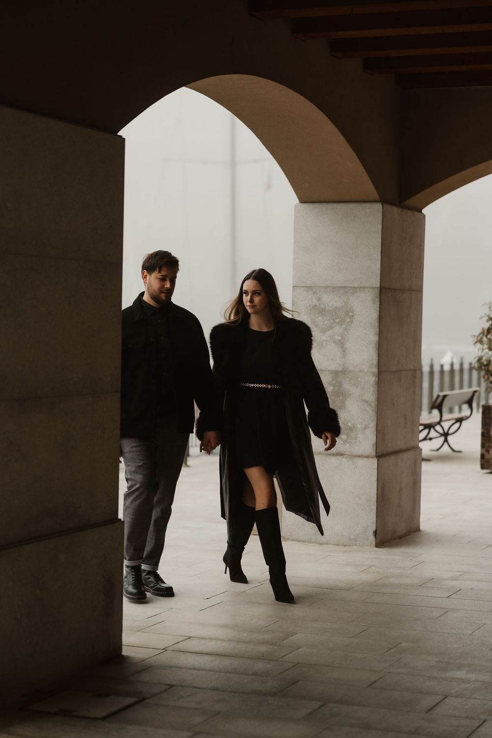 Intimate embrace between the modern stone architectures of Portopiccolo during a misty day.