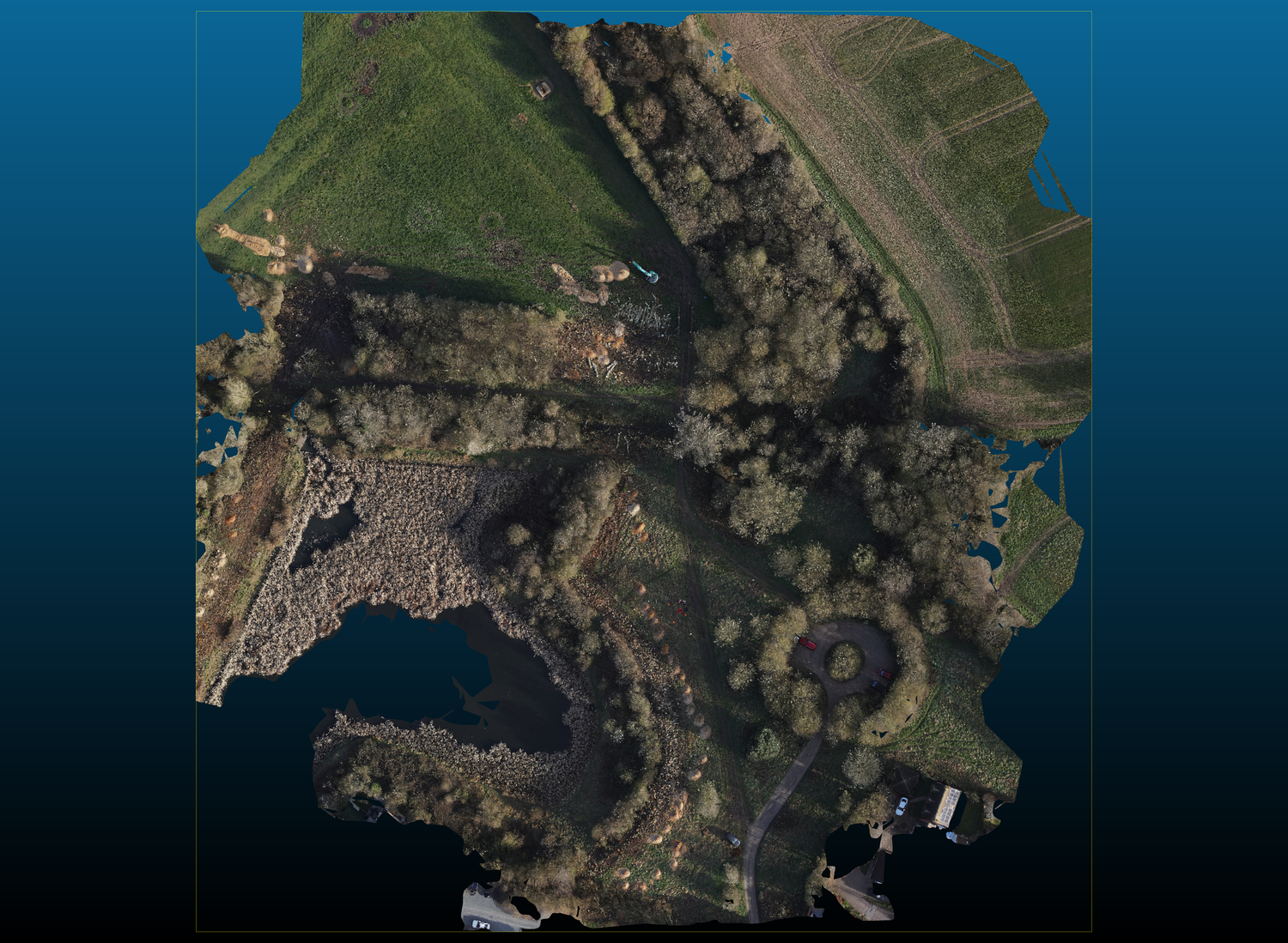 Aerial drone orthophoto map of a green landscape with trees, pathways, and water features captured from above.Aerial Site Intelligence