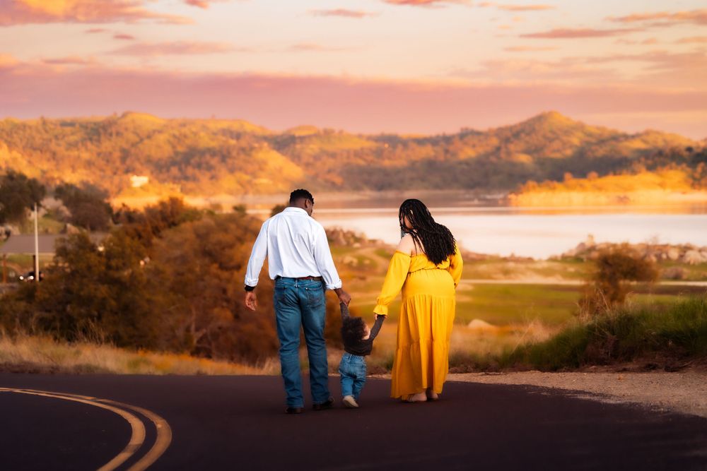 Photographer captures a family enjoying a serene lake at sunset near Fresno, CA