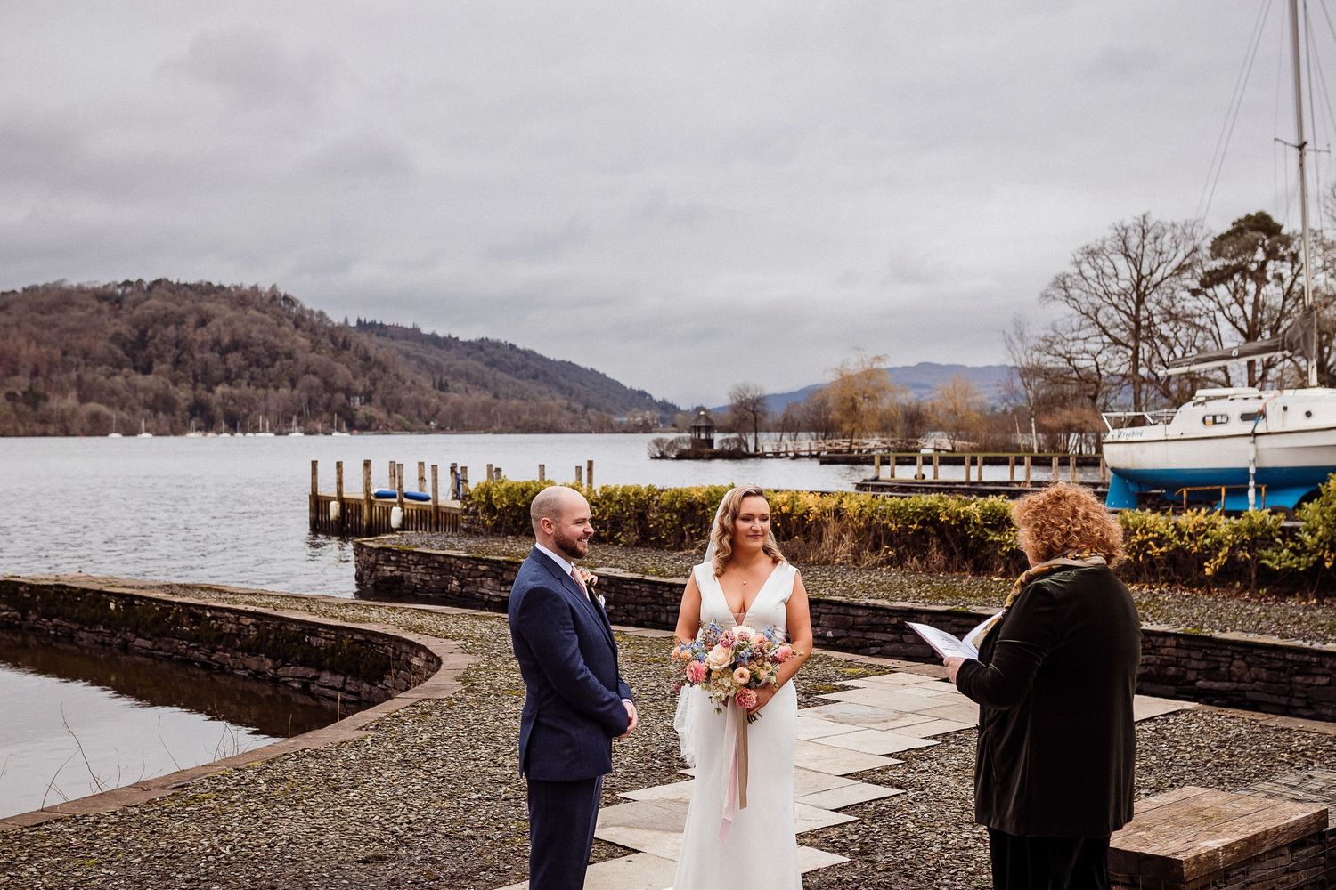 Steph and Stuart during their ceremony by the boathouse at Storrs Hall