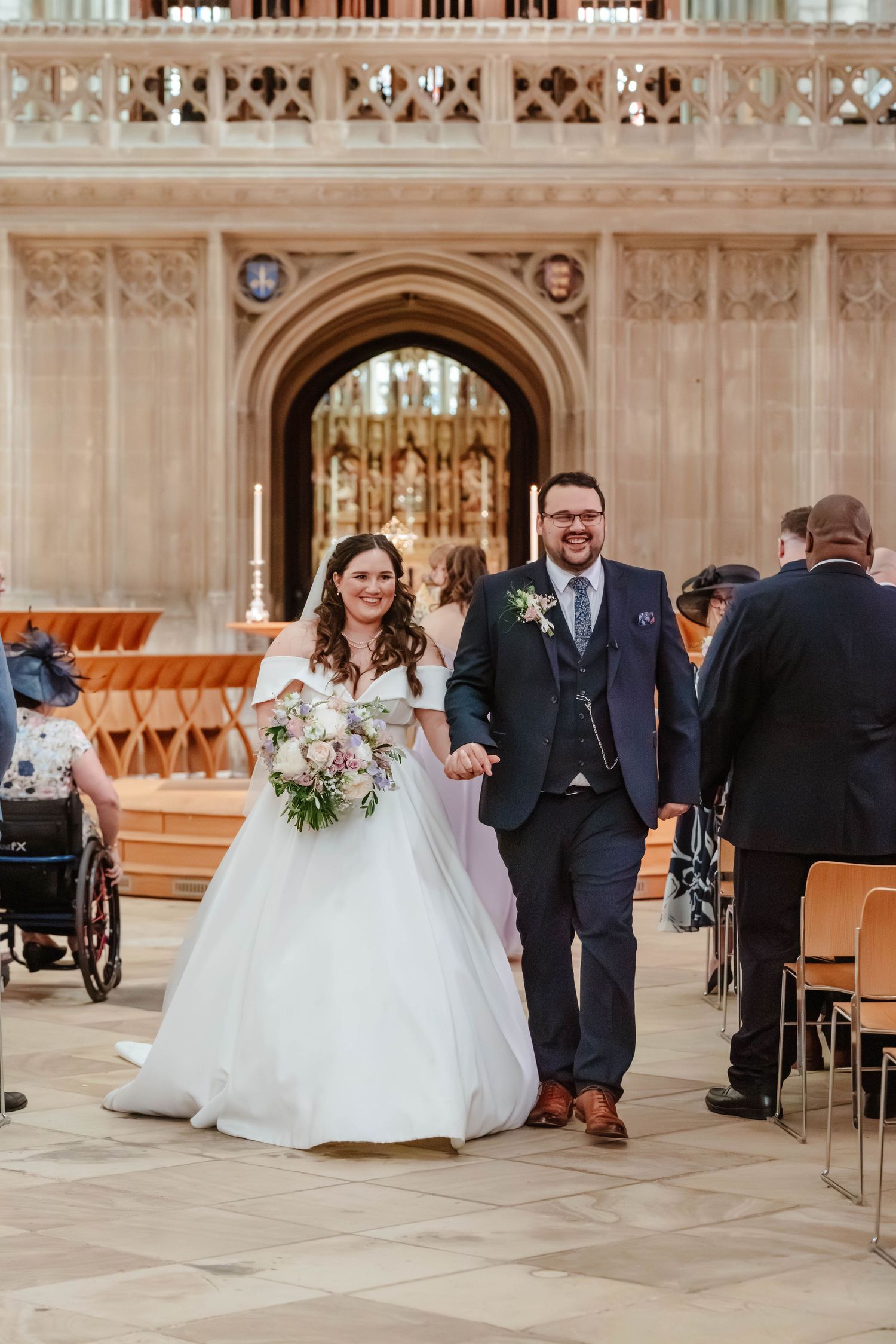 Gloucester Cathedral wedding photographer Gloucestershire Cheltenham Bride and Groom walking back down the aisle in the nave