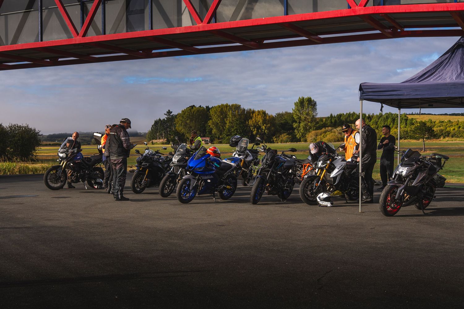 Group photo of motorcycles at a corporate event