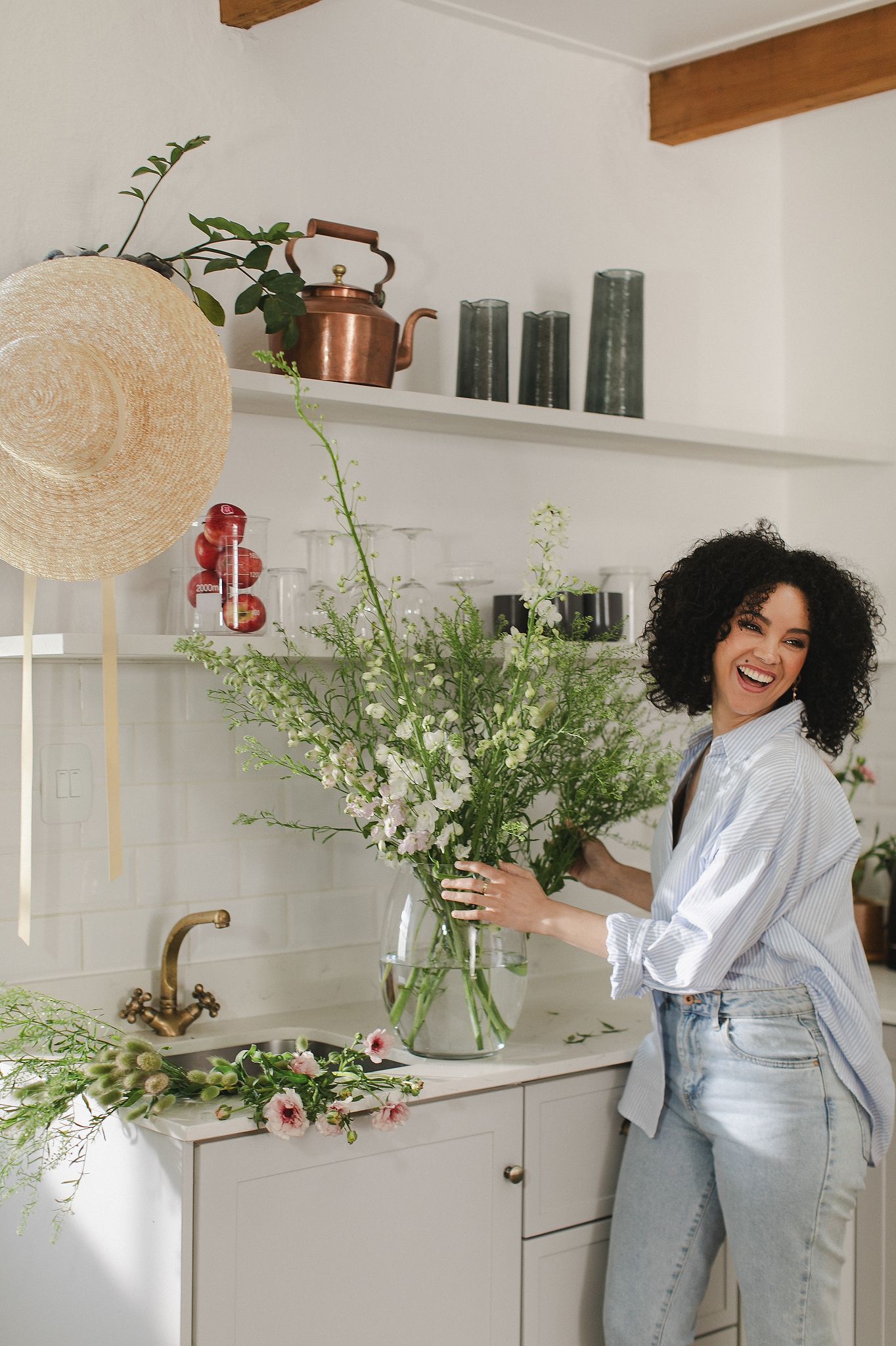 Flower arrangement happening in kitchen space