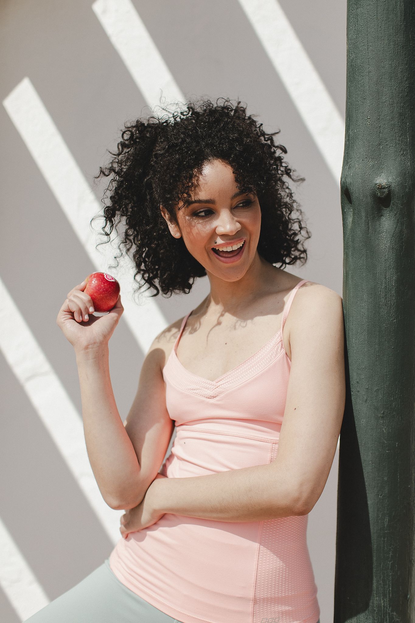 Pink Lady apples styled in a bright, clean setting with a fresh aesthetic.