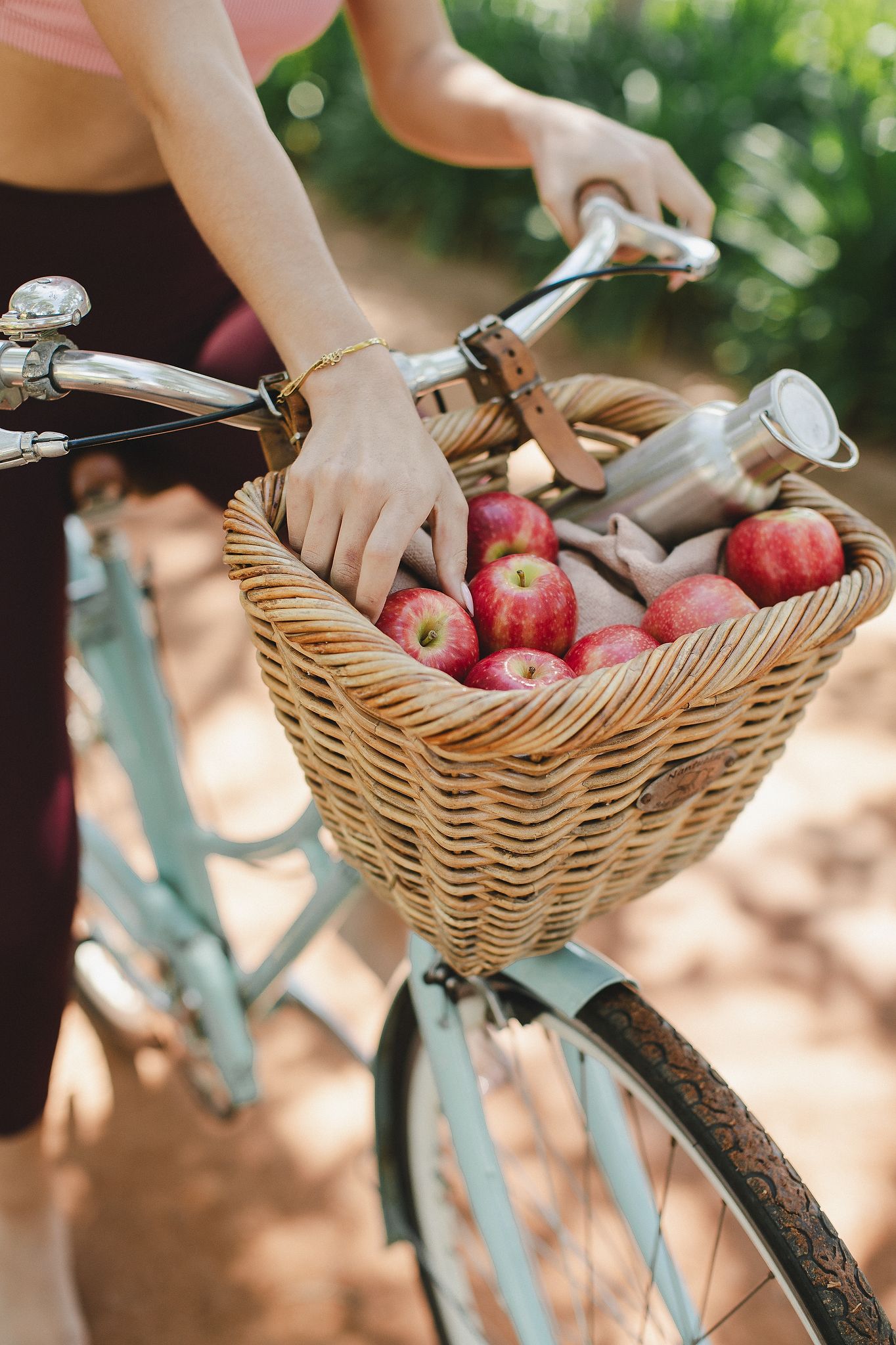 Pink Lady apples styled with leaves and stems for a fresh, orchard-inspired look.