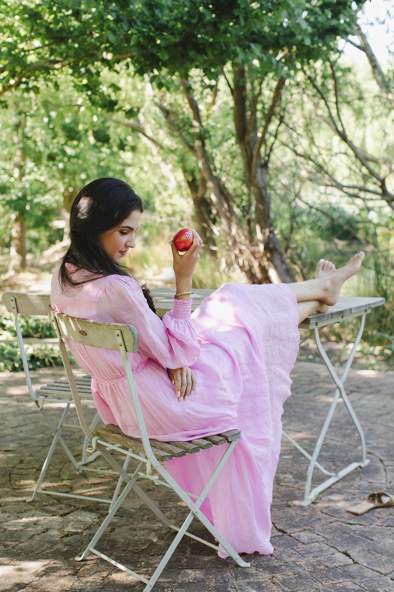 Pink Lady apples styled in a bright, clean setting with a fresh aesthetic.