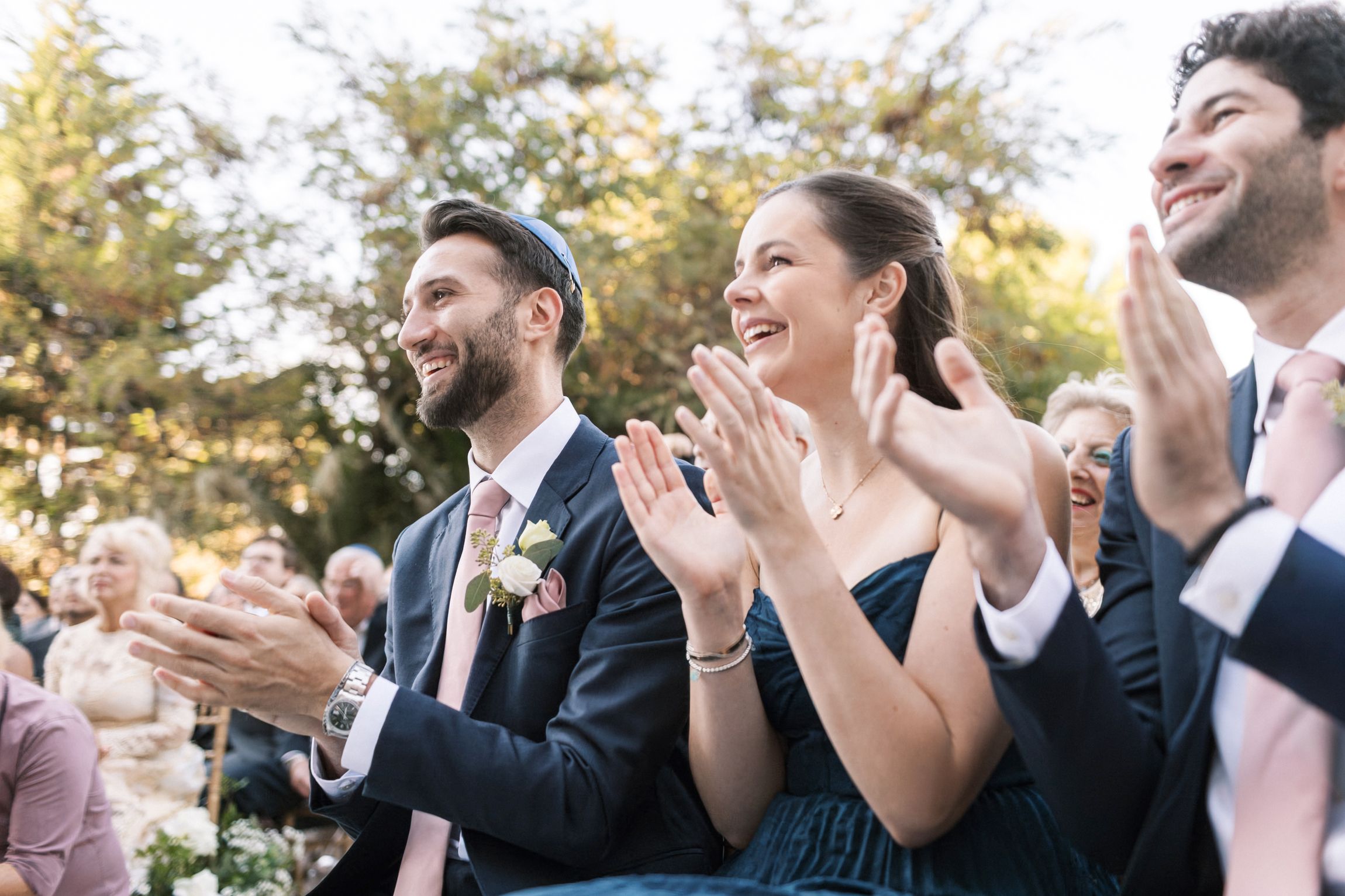 Joyful moment during the ceremony with guests cheering at wedding in Portugal