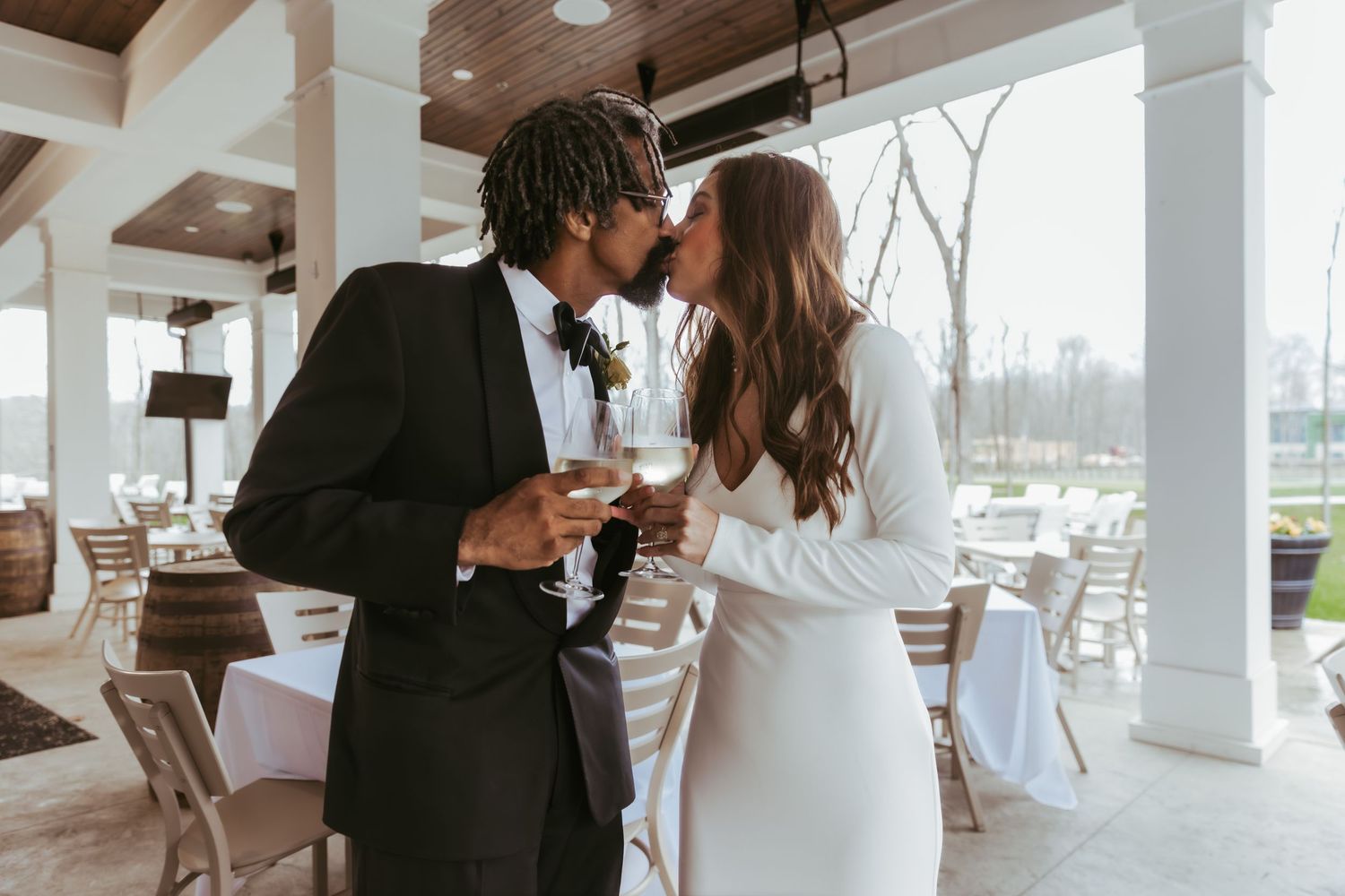Bride and groom champagne toast for their wedding reception at Holliday Farms in Zionsville, Indiana