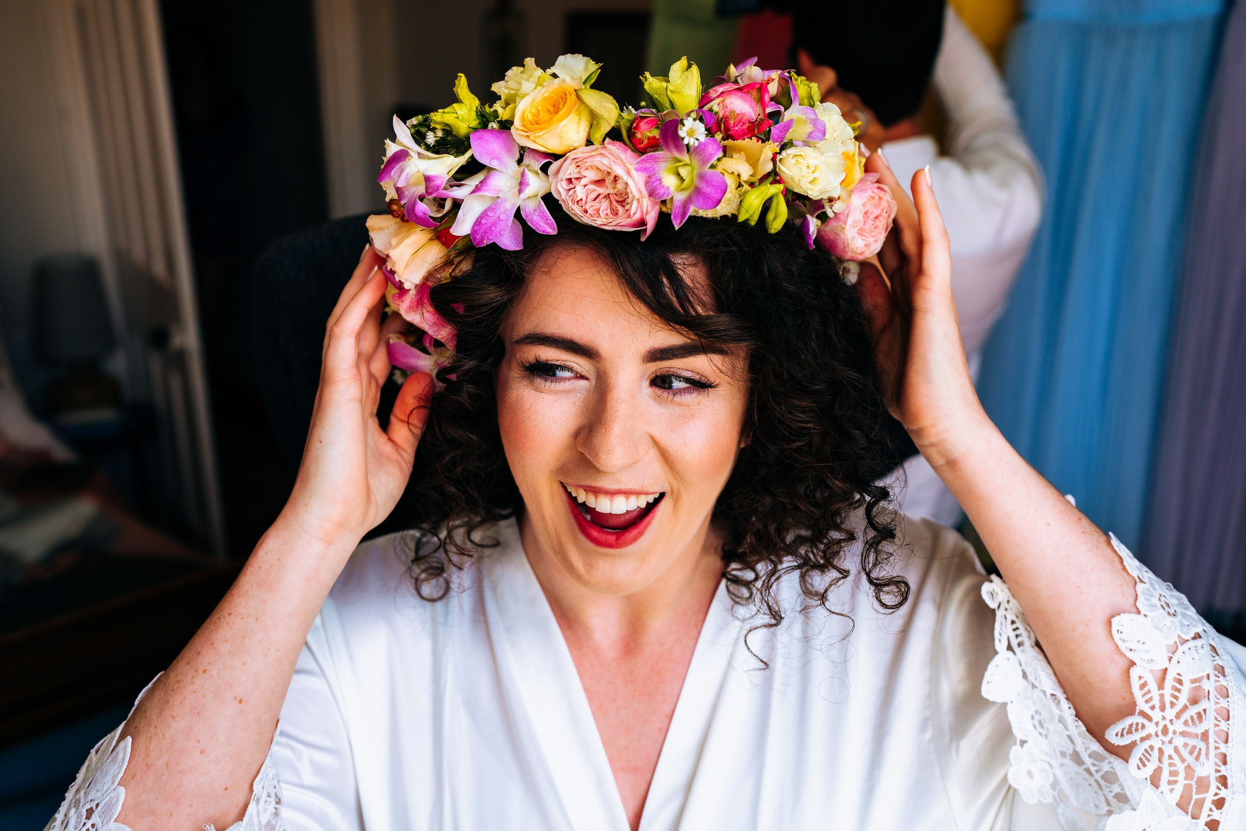 Fun bride adjusting her flower crown