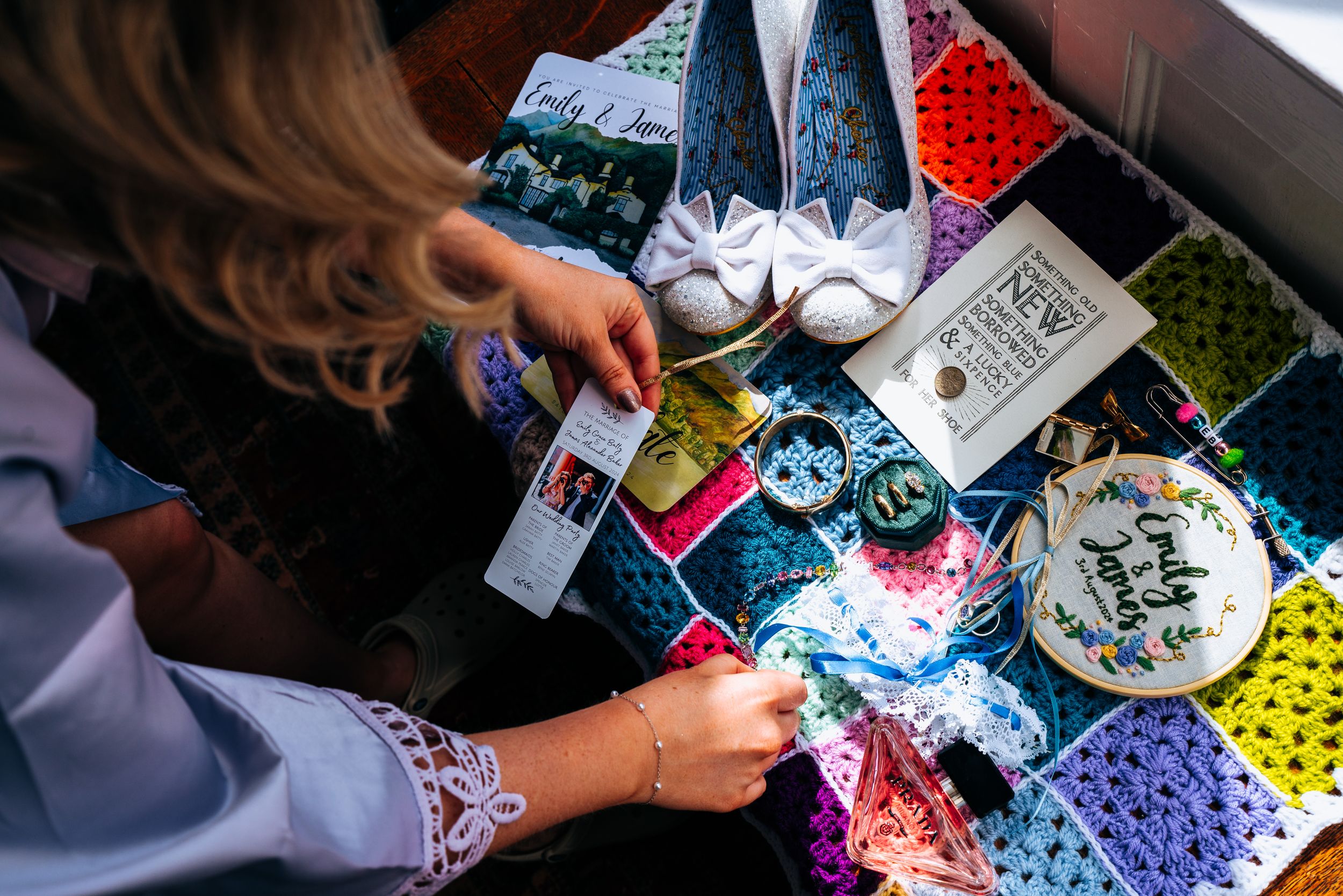 Colorful wedding flat lay with shoes, accessories, and decorative items on display.