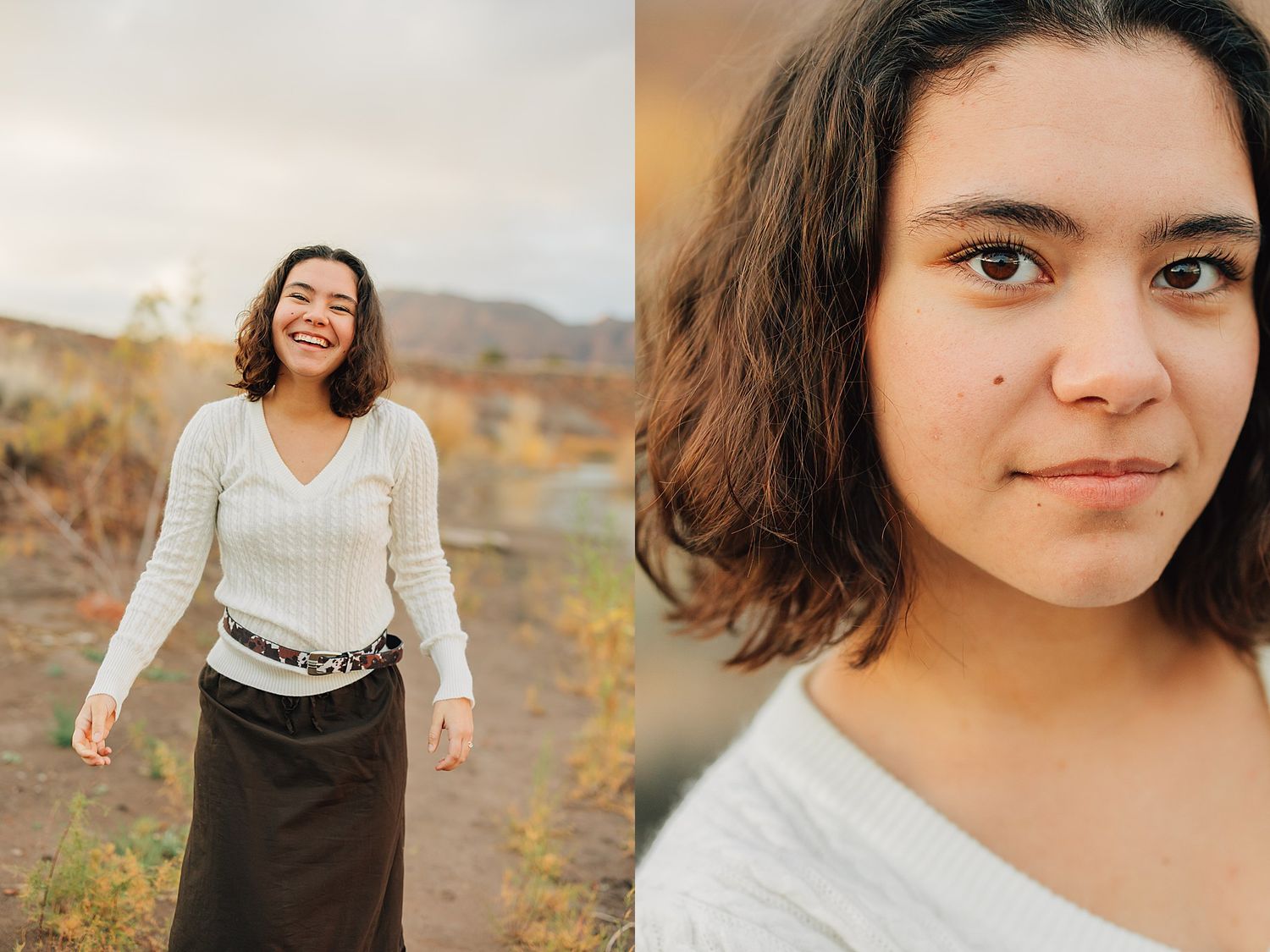 Young woman with short brown hair smiles outdoors in white sweater and dark skirt, with desert landscape background.