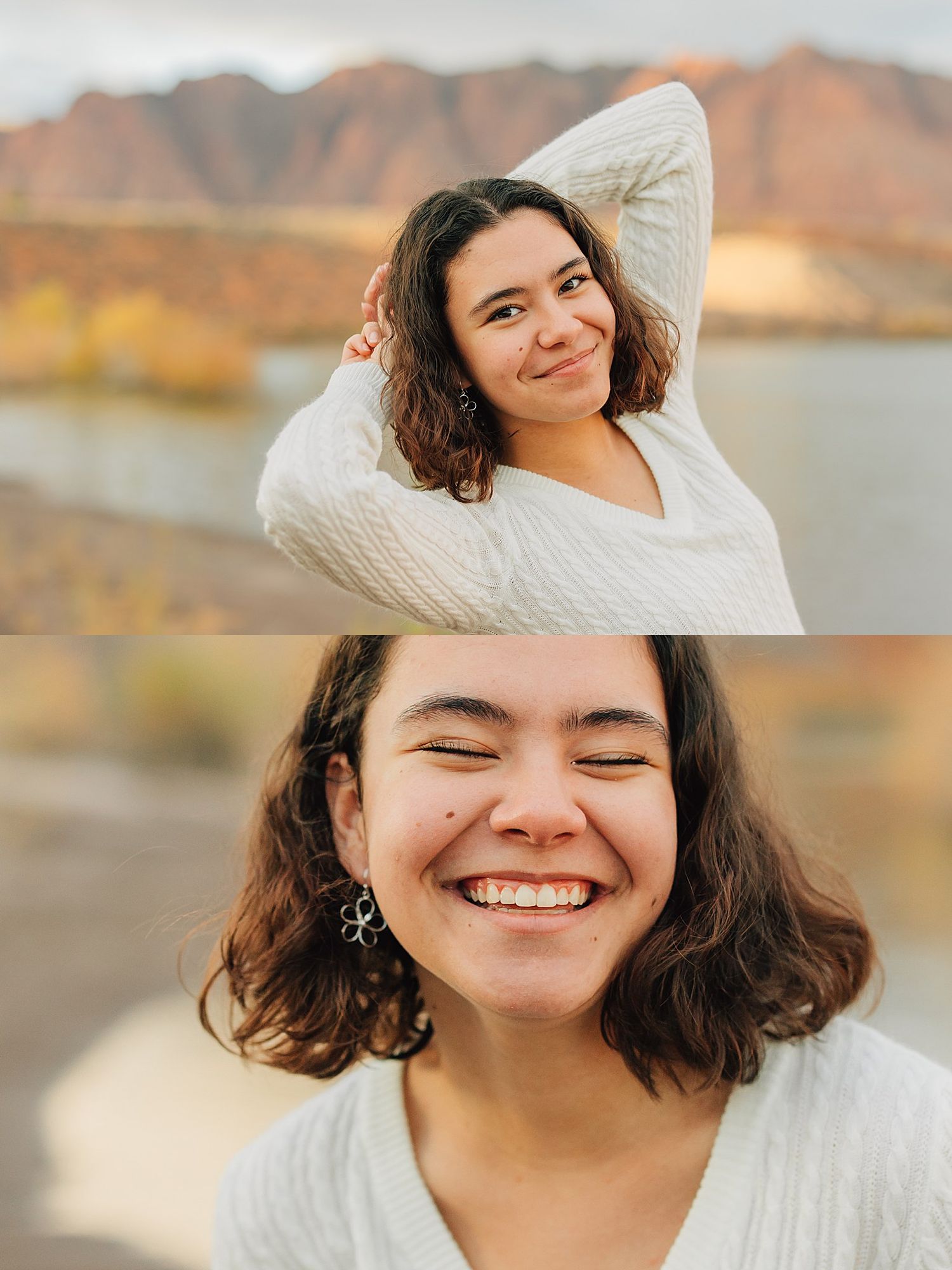 Young woman with curly hair in white sweater smiling outdoors near lake and mountains in autumn.