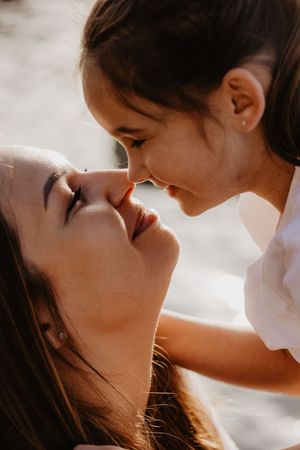 Intimate close-up shots showing tender moments between two people in natural lighting.